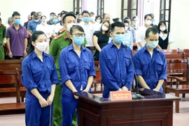 Các bị cáo tại phiên tòa. (Ảnh: Trần Hoàng Ngọc/TTXVN)