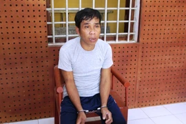 Đối tượng Nguyễn Văn Hùng tại cơ quan điều tra. (Ảnh: Thanh Tân/TTXVN)