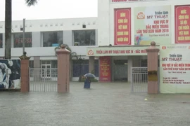 Thành phố Vinh ngập sâu trong nước, chiều 16/10. (Ảnh: Nguyễn Văn Nhật/TTXVN)