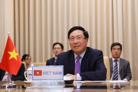 Phó Thủ tướng, Bộ trưởng Bộ Ngoại giao Phạm Bình Minh dự phiên thảo luận mở cấp cao trực tuyến của HĐBA LHQ về Khí hậu và An ninh. (Ảnh: Lâm Khánh/TTXVN)