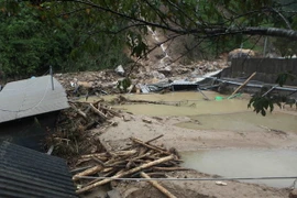 Trang trại nuôi cá nước lạnh bị tan hoang sau khi lũ dữ đi qua của gia đình nhà ông Dương Ngọc Hưng tại bản Chu Va 12, xã Sơn Bình, huyện Tam Đường, Lai Châu. (Ảnh: Quý Trung/TTXVN)