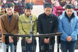 Bốn bị cáo tại phiên tòa. (Ảnh: Phan Quân/TTXVN)