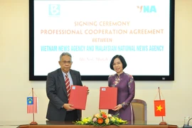 Hình ảnh TTXVN và Hãng Thông tấn quốc gia Malaysia ký kết hợp tác