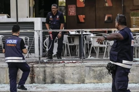Cảnh sát Malaysia điều tra tại hiện trường một vụ tấn công. (Nguồn: EPA/TTXVN)