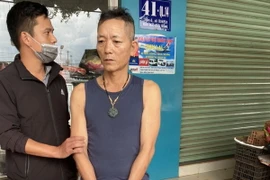 Đối tượng Hoàng khi bị bắt quả tang. (Ảnh: TTXVN phát)