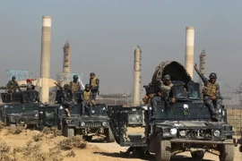 Các lực lượng Chính phủ Iraq tiến vào thành phố Kirkuk sau khi giành lại quyền kiểm soát thành phố này từ lực lượng người Kurd ngày 16/10. (Nguồn: AFP/TTXVN)