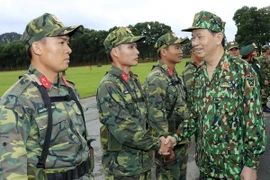 Chủ tịch nước Trần Đại Quang làm việc với Bộ Quốc phòng tại Trung tâm Huấn luyện Miếu Môn, Hà Nội. (Ảnh: Nhan Sáng/TTXVN)