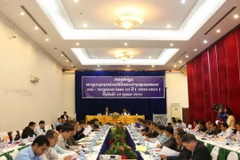 Quang cảnh hội nghị tổng kết 10 năm hợp tác phát triển cụm bản khu vực biên giới Việt Nam-Lào. (Ảnh: Phạm Kiên/TTXVN) 