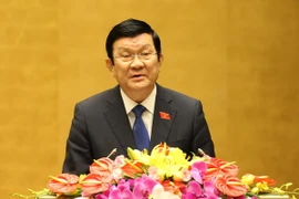 Chủ tịch nước Trương Tấn Sang trình bày Báo cáo công tác nhiệm kỳ 2011-2016. (Ảnh: Nhan Sáng/TTXVN)