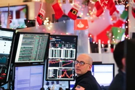 Giao dịch viên tại Sàn giao dịch chứng khoán New York, Mỹ ngày 2/1. (Nguồn: THX/TTXVN)