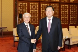 Tổng Bí thư Nguyễn Phú Trọng hội kiến Ủy viên Thường vụ Bộ Chính trị, Ủy viên trưởng Ủy ban Thường vụ Đại hội Đại biểu Nhân dân toàn quốc Trung Quốc (Chủ tịch Quốc hội) Trương Đức Giang. (Ảnh: Trí Dũng/TTXVN)