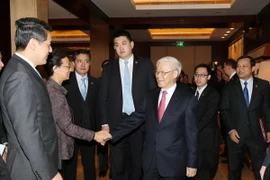 Tổng Bí thư Nguyễn Phú Trọng với các đại biểu tại cuộc gặp gỡ. (Ảnh: Trí Dũng/TTXVN)