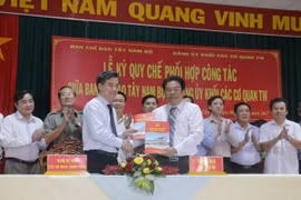 Quang cảnh lễ ký kết. (Ảnh: Ngọc Thiện/TTXVN)