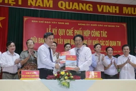 Quang cảnh lễ ký kết. (Ảnh: Ngọc Thiện/TTXVN)