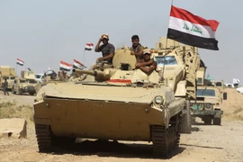 Các lực lượng Iraq tiến vào Hawija trong chiến dịch giải phóng thị trấn này từ IS ngày 2/10. (Nguồn: AFP/TTXVN)