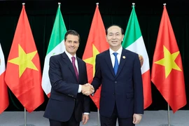 Chủ tịch nước Trần Đại Quang gặp song phương Tổng thống Mexico Enrique Peña Nieto. (Ảnh: TTXVN)