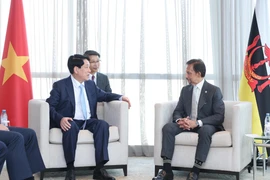 Chủ tịch nước Lương Cường gặp Quốc vương Brunei Hassanal Bolkiah. (Ảnh: Lâm Khánh/TTXVN)