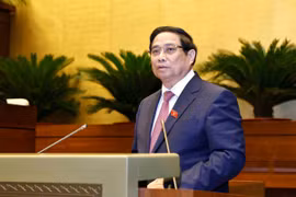Thủ tướng Phạm Minh Chính trình bày Báo cáo kết quả thực hiện kế hoạch phát triển kinh tế-xã hội năm 2024, dự kiến kế hoạch phát triển kinh tế-xã hội năm 2025. (Ảnh: Doãn Tấn/TTXVN)