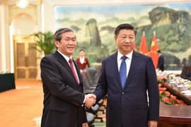 Ủy viên Bộ Chính trị, Thường trực Ban Bí thư Đinh Thế Huynh hội kiến Tổng Bí thư, Chủ tịch nước Trung Quốc Tập Cận Bình. (Ảnh: Lê Trung Kiên/TTXVN)