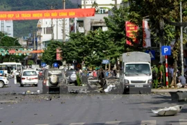 Hiện trường vụ cháy nổ xe taxi. (Ảnh: Lê Trung Nguyên/TTXVN)