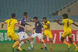 Thiếu vắng nhiều trụ cột nhưng Hà Nội FC vẫn chơi một trận tưng bừng trước đối thủ tới từ Singapore. (Ảnh: Tá Hiển/Vietnam+)