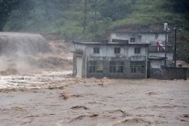 Mưa lớn tại tỉnh An Huy ngày 1/7. (Nguồn: THX/TTXVN)
