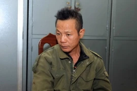 Đối tượng Nguyễn Văn Kỳ tại trụ sở công an . (Ảnh: Doãn Tấn/TTXVN)