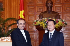 Phó Thủ tướng Vũ Văn Ninh tiếp Bộ trưởng Công nghiệp, Mỏ và Thương mại Iran. (Ảnh: Nguyễn Dân/TTXVN)