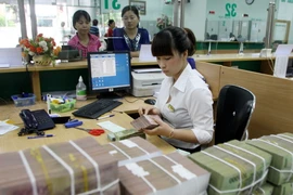 Phấn đấu đến cuối năm 2015 đưa tỷ lệ nợ xấu dưới 3%