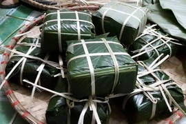 Bánh chưng là một thực phẩm quen thuộc ngày Tết. (Ảnh: PV/Vietnam+)