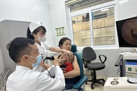 Hiện nay, chính sách bảo hiểm y tế ở Việt Nam ngày càng phát triển, hoàn thiện. (Ảnh: T.G/Vietnam+)