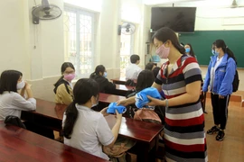 Chương trình “Vững vàng Việt Nam” nhằm nâng cao nhận thức của người dân về phòng bệnh COVID-19. (Ảnh: An Đăng/TTXVN)