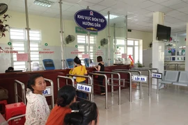 Khu vực đón tiếp người bệnh khám bảo hiểm y tế. (Ảnh: T.G/Vietnam+)