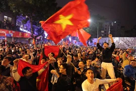 Người dân xuống đường mừng chiến thắng lịch sử của U23 Việt Nam (Ảnh: Lê Minh Sơn/Vietnam+)