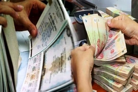 Tổng khối lượng trái phiếu Chính phủ huy động thành đạt 273.306 tỷ đồng và tăng 1,8 lần so với cùng kỳ 10 tháng của năm 2022. (Ảnh: Vietnam+)