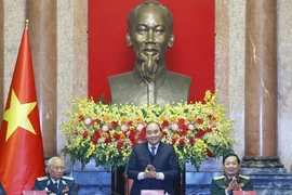 Chủ tịch nước Nguyễn Xuân Phúc tại buổi gặp mặt Ban Liên lạc Cựu chiến binh Sư đoàn Phòng không 361. (Ảnh: Thống Nhất/TTXVN)