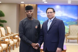Thủ tướng Phạm Minh Chính tiếp Phó Tổng thống Nigeria Yemi Osinbajo. (Ảnh: Dương Giang/TTXVN)