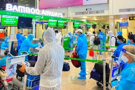 Hơn 600 công dân Bắc Giang đang sinh sống khu vực miền Nam được trở về quê trên chuyến bay của Bamboo Airways. (Ảnh: CTV/Vietnam+)