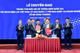 Lễ ký kết biên bản bàn giao giữa Ủy ban Quản lý vốn nhà nước tại doanh nghiệp và Bộ Công Thương. (Ảnh: Đức Duy/Vietnam+)