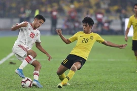 Malaysia (áo vàng) thua ngược UAE trên sân nhà. (Nguồn: AFC)