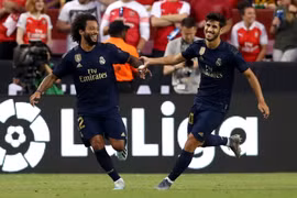 Asensio và Marcelo ăn mừng sau pha phối hợp ghi bàn đẹp mắt. (Nguồn: Getty Images)