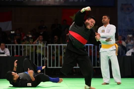 Nguyễn Văn Trí ăn mừng chiến thắng. (Ảnh: Quốc Khánh/TTXVN)