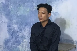 Đối tượng Nguyễn Tấn Hoàng Khánh tại cơ quan công an. (Ảnh: TTXVN phát)