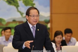 Bộ trưởng Trương Minh Tuấn trả lời tại phiên chất vấn chiều 18/4. (Ảnh: Phương Hoa/TTXVN)