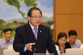 Bộ trưởng Trương Minh Tuấn trả lời tại phiên chất vấn chiều 18/4. (Ảnh: Phương Hoa/TTXVN)