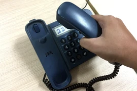 Kẻ gian lợi dụng sự nhẹ dạ của người dân để lừa đảo qua hình thức gọi điện vào số điện thoại cố định. (Ảnh: T.H/Vietnam+)