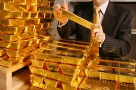 Vàng thế giới tăng phiên thứ 5 trước sự giảm giá của đồng USD