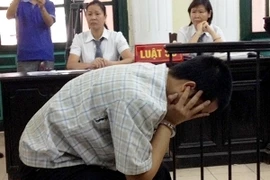 Đặng Trần Hoài tỏ vẻ mệt mỏi tại phiên xử sáng 25/10 (Ảnh: Sơn Bách/Vietnam+)