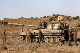 Binh sỹ Israel tham gia một cuộc diễn tập quân sự tại Cao nguyên Golan, gần Merom Golan trên biên giới với Syria. (Ảnh: AFP/TTXVN)