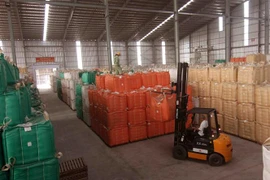 Chuẩn bị nguồn hàng gạo xuất khẩu tại nhà máy của Tập đoàn Lộc Trời (tỉnh An Giang). (Ảnh: Vũ Sinh/TTXVN)